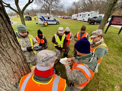 A CAP ground team receives a briefing for an upcoming search sortie. Photo Credit: H. Michael Miley Capt. CAP